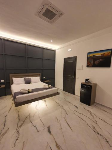 Ένα ή περισσότερα κρεβάτια σε δωμάτιο στο MikAle Luxury Rooms