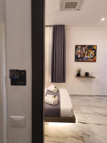 Ένα ή περισσότερα κρεβάτια σε δωμάτιο στο MikAle Luxury Rooms