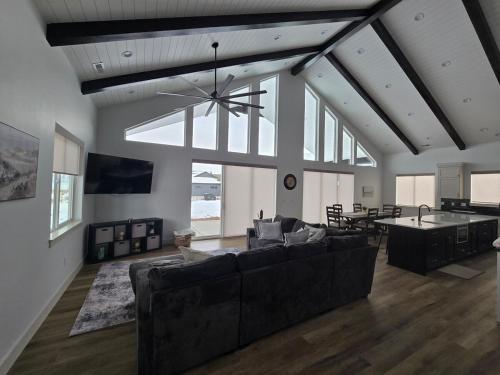 a living room with a couch and a table at Sky Sapphire Haven in Fish Haven