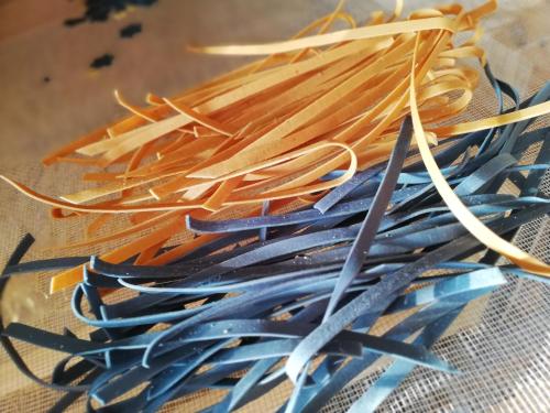 a pile of straws sitting on a table at Sailor Apartman Balatonlelle in Balatonlelle