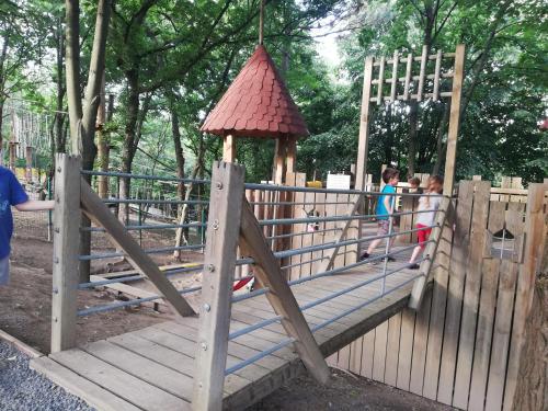 a playground with a gazebo in a park at Sailor Apartman Balatonlelle in Balatonlelle