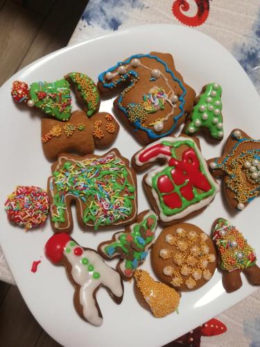 a plate of decorated gingerbread cookies on a table at Sailor Apartman Balatonlelle in Balatonlelle