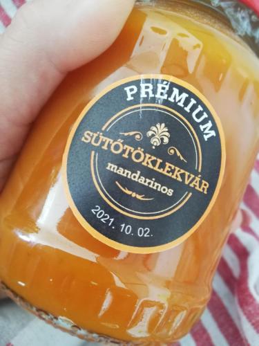 a bottle of honey with a sticker on it at Sailor Apartman Balatonlelle in Balatonlelle