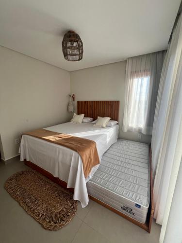 a bedroom with a large bed and a window at Sunny Kite House Prea in Prea