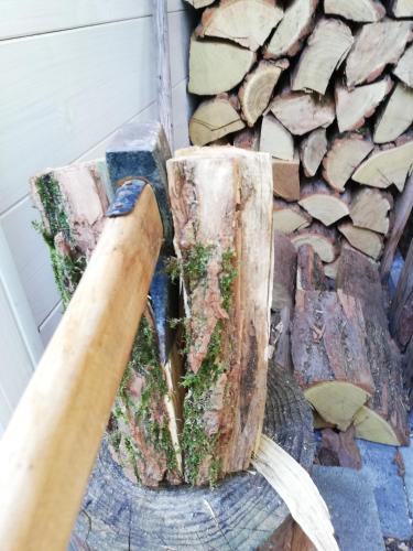 a baseball bat and a pile of wood at Sailor Apartman Balatonlelle in Balatonlelle