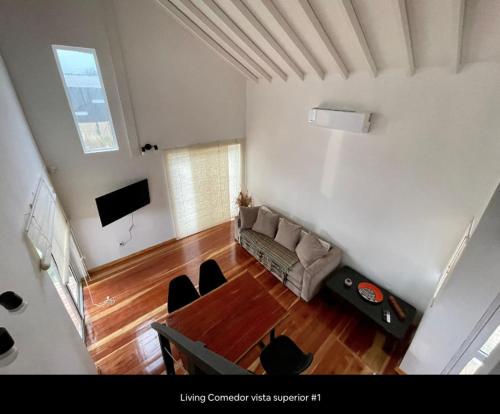 a living room with a couch and a table at Casa Gaia in La Paloma