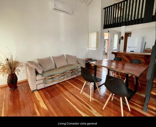 a living room with a couch and a table at Casa Gaia in La Paloma