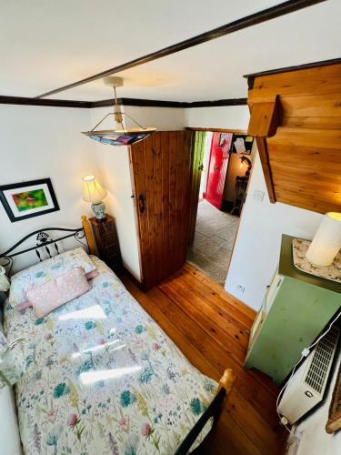 a bedroom with a bed and a desk with a computer at The Limehouse Cottage in Killybegs