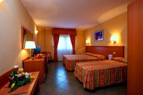 Postel nebo postele na pokoji v ubytování TH Cinisi - Florio Park Hotel