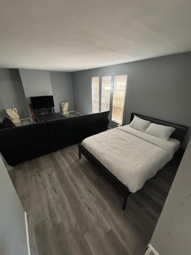 a bedroom with a bed and a desk in it at 2 or 3 Bedroom Extended Stay Walk to Strip MGM Casino Shop Club in Las Vegas
