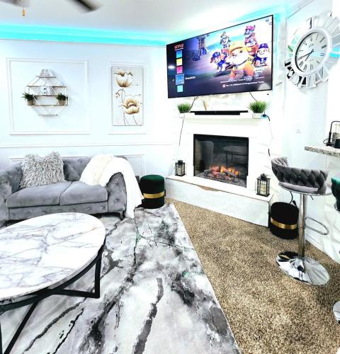 a living room with a couch and a fireplace at Home-away-from-Home in Odessa