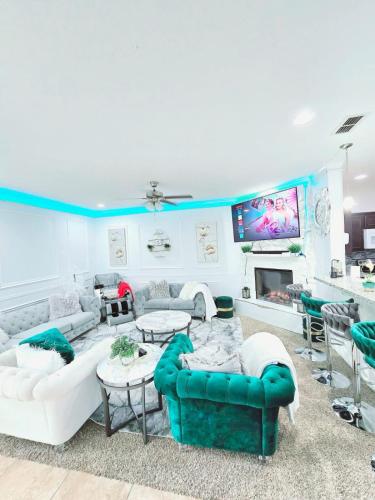 a large living room with couches and a tv at Home-away-from-Home in Odessa