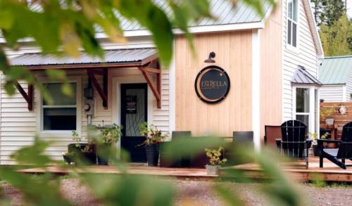a house with a sign on the front of it at Estrella Glamping in Caraquet
