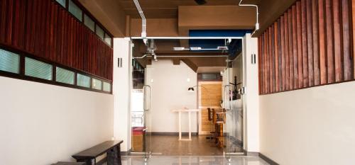 an open hallway with a table in a room at KENCOZY accommodation in Bangkok