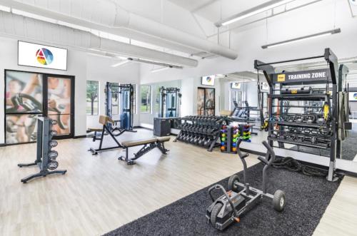 a gym with several treadmills and exercise equipment at 1 Bedroom Studio Townhouse in Uptown Charlotte in Charlotte