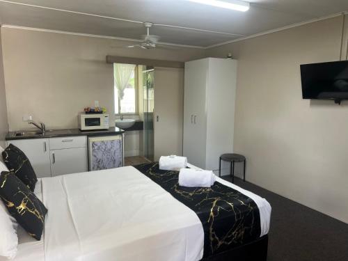 Kuchyň nebo kuchyňský kout v ubytování Kalua Motel