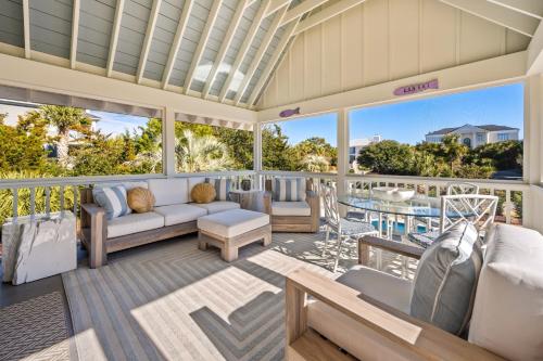 a living room with a couch and a table at High Seas in DeBordieu Colony home by Peace Vacations in Georgetown