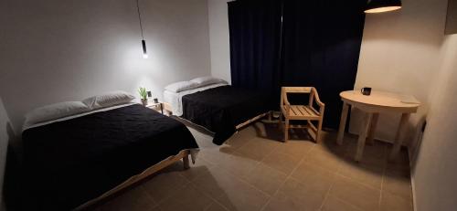 Postel nebo postele na pokoji v ubytování Hotel Caminos
