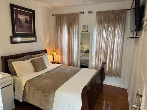 a bedroom with a large bed and a window at Dayton Dream in Newark