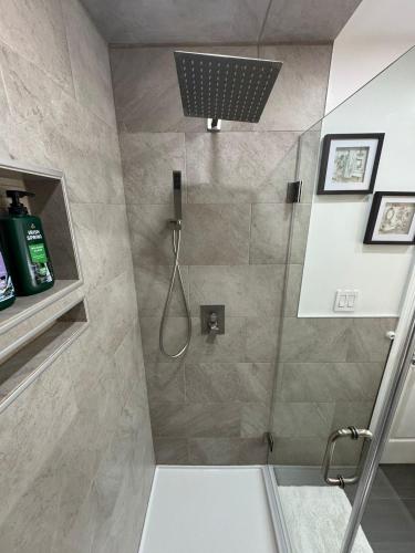 a bathroom with a shower with a glass door at Dayton Dream in Newark