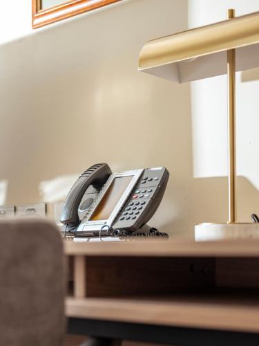 a phone sitting on top of a desk at Lenna Of Hobart in Hobart