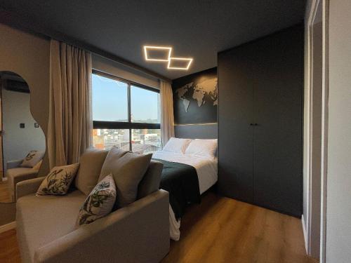 Katil atau katil-katil dalam bilik di EDIFICIO UP - Loft próximo a Vila Germânica e FURB com vaga.