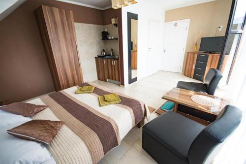 a hotel room with a bed and a desk with a chair at Villa in Brenna near Ski Lifts in Brenna