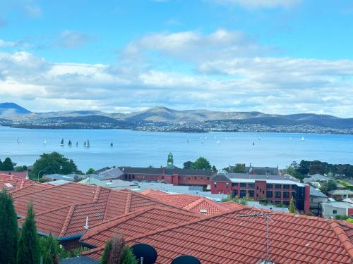 a view of a large body of water with boats in it at Hobart Bay Sunrise House--Rare Aurora Viewing Opportunities in Hobart