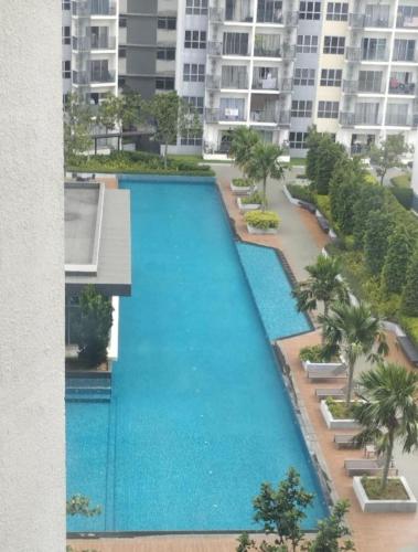 an overhead view of a large swimming pool in a building at The Luxe Sanctuary in Southville City in Bangi