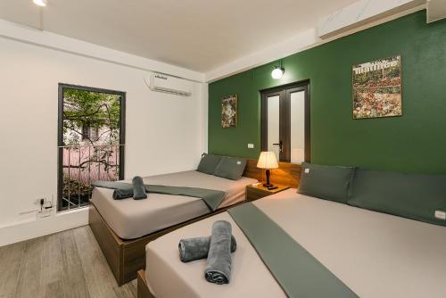 Postel nebo postele na pokoji v ubytování Toycan House - 50m to Hoan Kiem lake