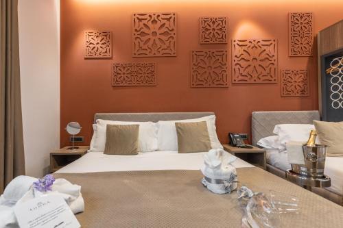 a hotel room with a bed and a table at Giafra Luxury Rooms in Agrigento