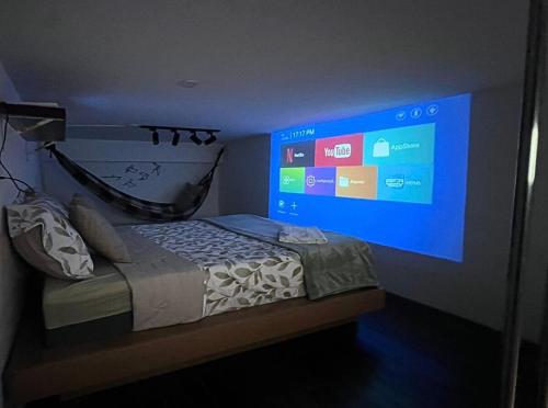 Μια τηλεόραση ή/και κέντρο ψυχαγωγίας στο Loft charmoso e confortável - BH