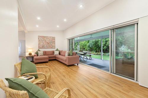 a living room with a couch and a table at Reflections Evans Head - Holiday Park in Evans Head