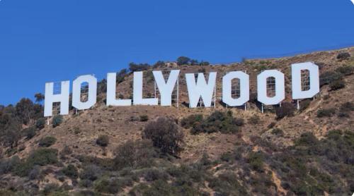 a hollywood sign on top of a mountain at Beautiful 4BD and 3BA Pool Jacuzzi Vacation Home in Los Angeles