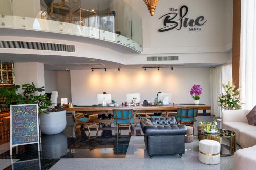 a lobby of a blue room with a bar at The Blue Mavi Hotel in Chalong 