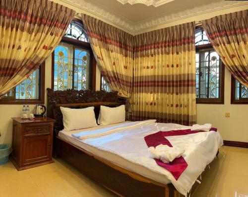 Postel nebo postele na pokoji v ubytování Lotus Blanc Homestay Villa