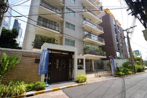 a building with a gate in front of it at Baan Sukhumvit14 in Bangkok