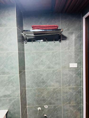 a bathroom with a shower with a tiled floor at Sapa Grand Blue Hotel in Sa Pa