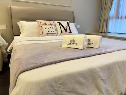 a bedroom with two beds with pillows on them at TheBess Hotel Tokyo is located adjacent to Singapore and offers a sea viewIt is a family business smart room with the sea view of Princess Bay富力公主湾 in Johor Bahru