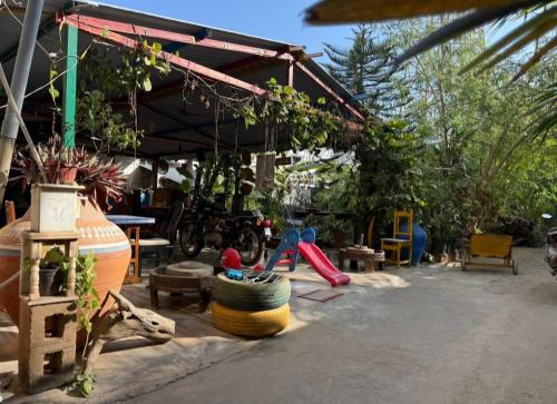 a play area with a playground with a slide at Dream Vision Guest House in Diu