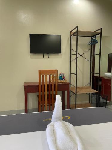 a towel is on top of a table at Coastal Haven Resort in Siquijor