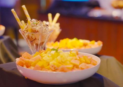 two bowls of food sitting on a table at Sueen Nature Resort in Pelenda