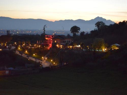 a view of a city at night with lights at Queen Hotel in San Giovanni Teatino