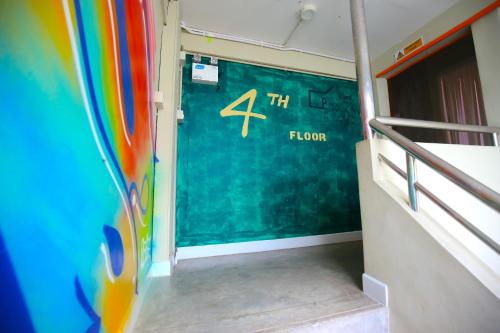 a room with a door with the number four on it at Here We Go Bangkok in Bangkok