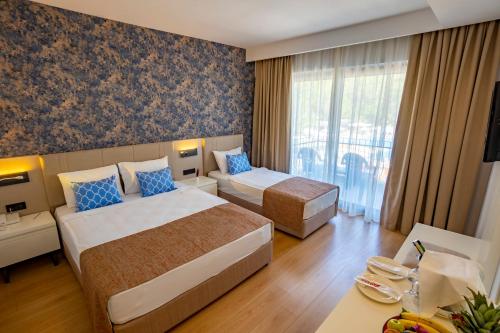 Postel nebo postele na pokoji v ubytování Eldar Garden Resort