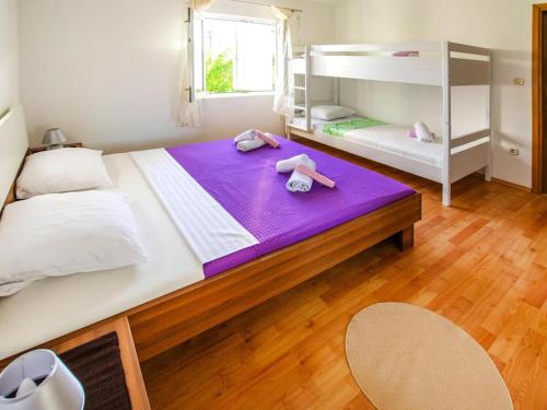 Postel nebo postele na pokoji v ubytování Apartment in Seline near Paklenica Park