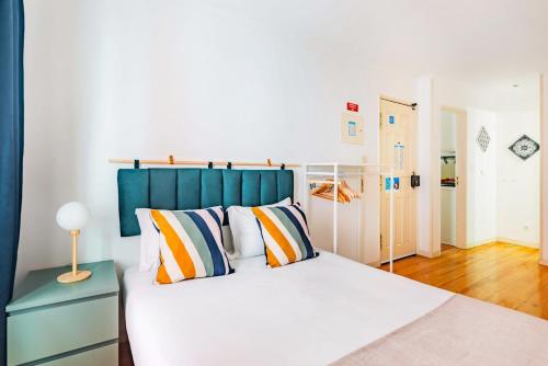 Ένα ή περισσότερα κρεβάτια σε δωμάτιο στο Alfama Comfy Studio