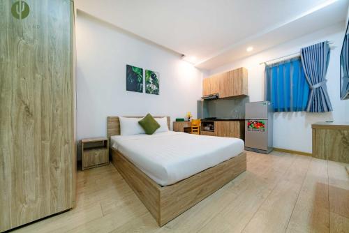 Un ou plusieurs lits dans un hébergement de l'établissement Cactusland Hotel & Apartment