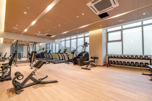 a gym with treadmills and elliptical machines at Stanford hotel Andong in Andong