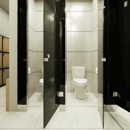 a bathroom with a toilet and twoflush toilets at Volbs in Tanah Lot